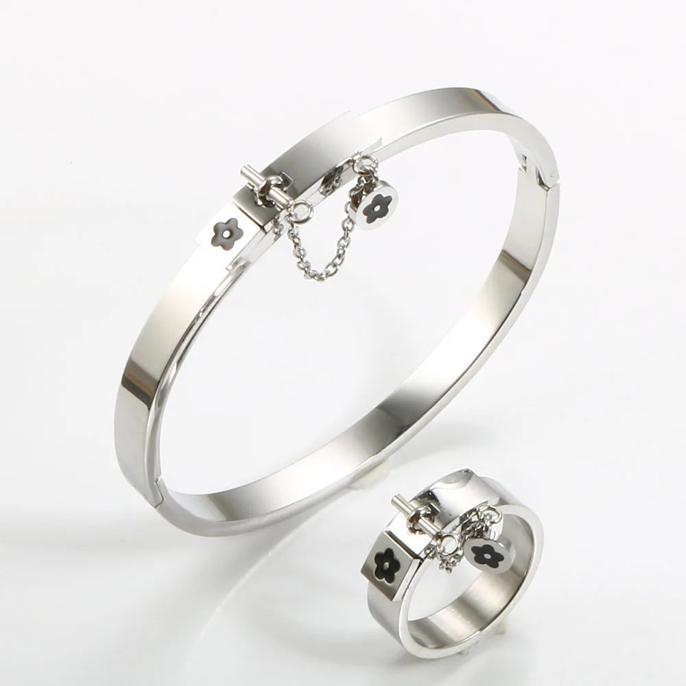 LuxéGlow™ Golden Stainless Steel Jewelry Set – Unisex Bangle Bracelet & Flower Charm Ring