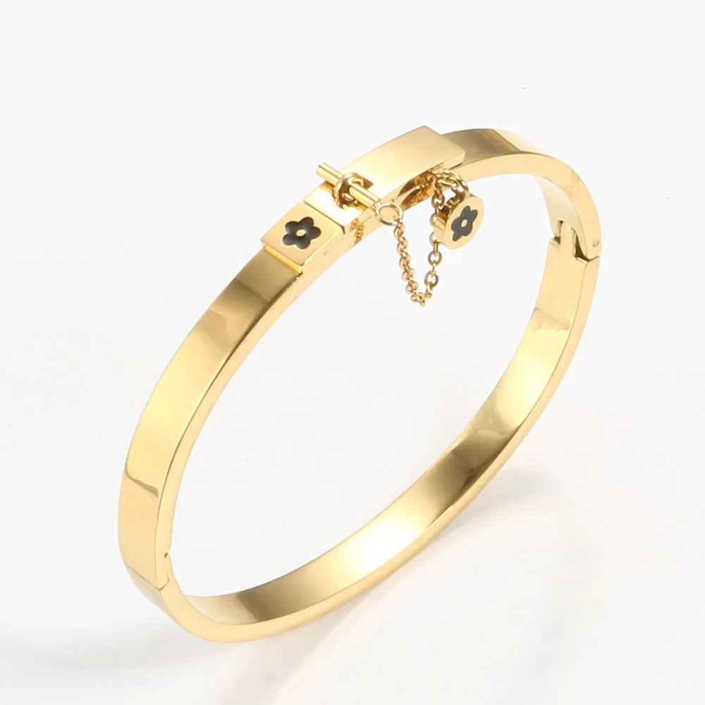 LuxéGlow™ Golden Stainless Steel Jewelry Set – Unisex Bangle Bracelet & Flower Charm Ring