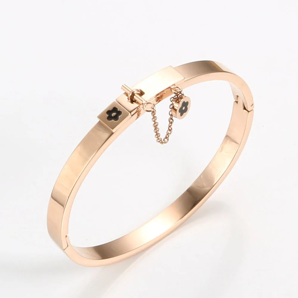 LuxéGlow™ Golden Stainless Steel Jewelry Set – Unisex Bangle Bracelet & Flower Charm Ring