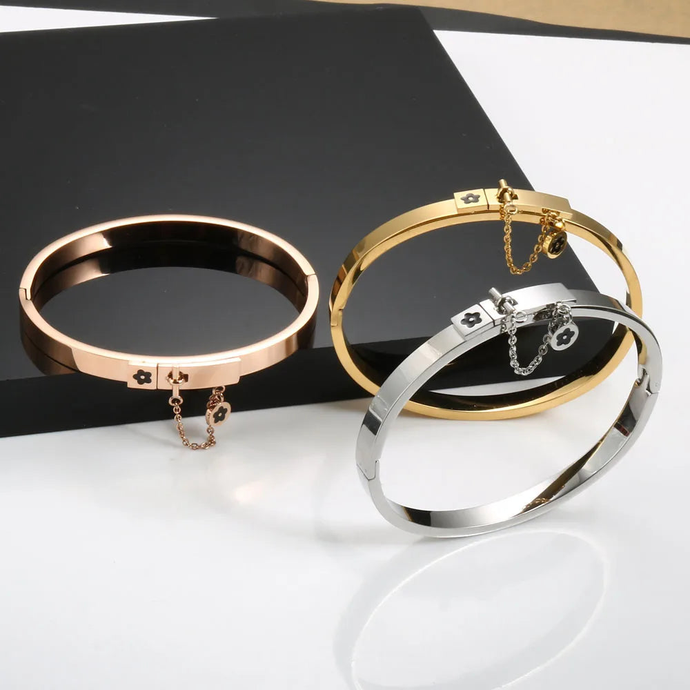 LuxéGlow™ Golden Stainless Steel Jewelry Set – Unisex Bangle Bracelet & Flower Charm Ring