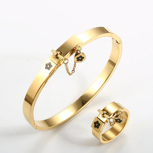 LuxéGlow™ Golden Stainless Steel Jewelry Set – Unisex Bangle Bracelet & Flower Charm Ring