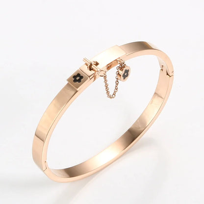 LuxéGlow™ Golden Stainless Steel Jewelry Set – Unisex Bangle Bracelet & Flower Charm Ring